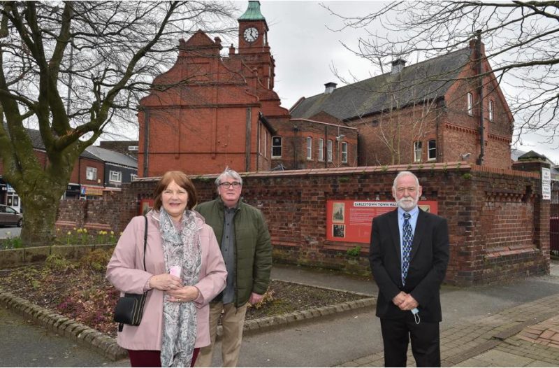 Jeanette, Dave and Charlie take a look at the information boards in place at the Town Hall
