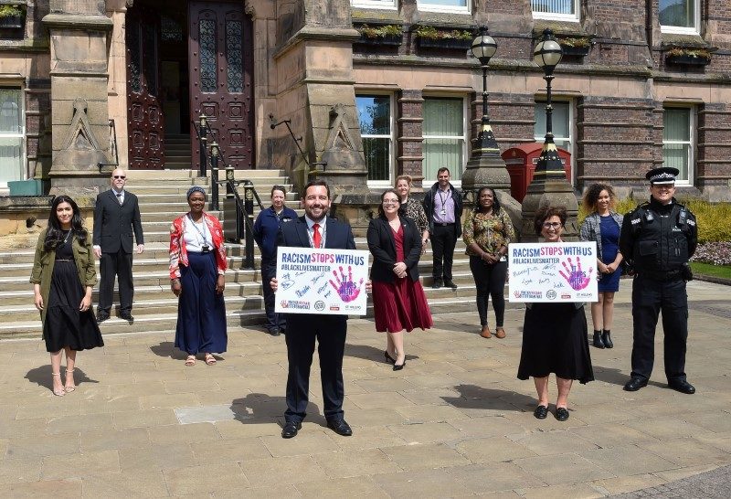 Cllr Bell, Cllr Baines and others at the signing of the declaration at St Helens Town Hall