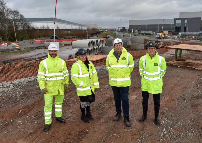 Cllr McCauley (second right) at the Omega site earlier this year