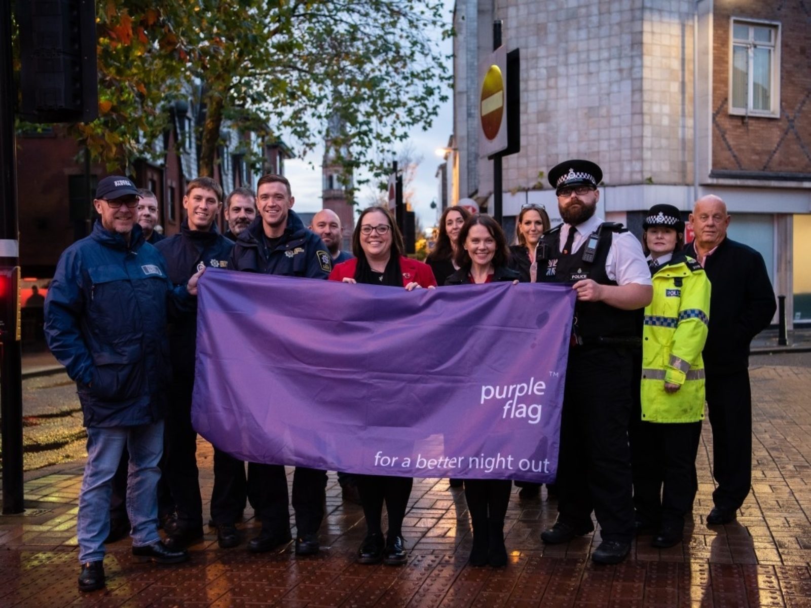 Cllr Jeanie Bell, Merseyside Police and other agencies celebrating the Purple Flag award
