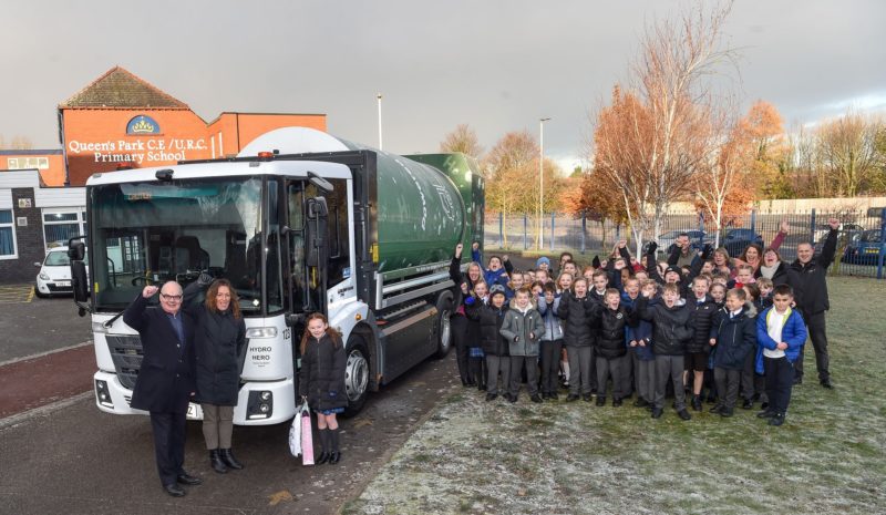 Cllr Andy Bowden with the winner and her classmates and staff at Queen