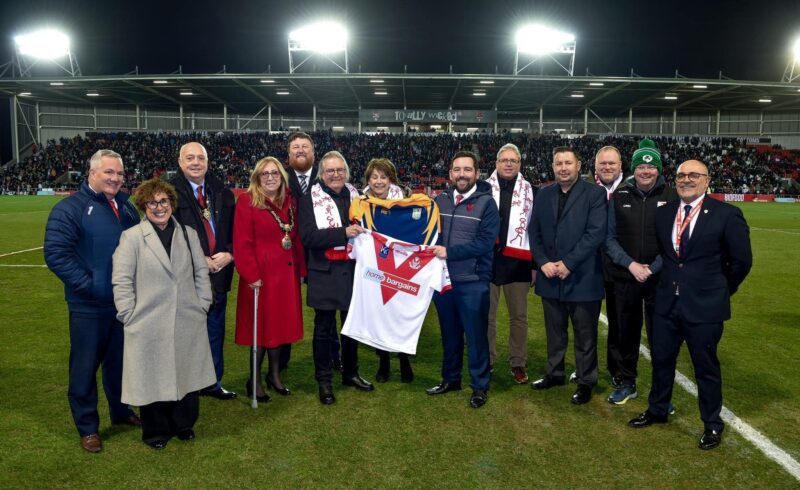 The delegation and council representatives were invited to the Saints v Leeds game by the club and swapped shirts