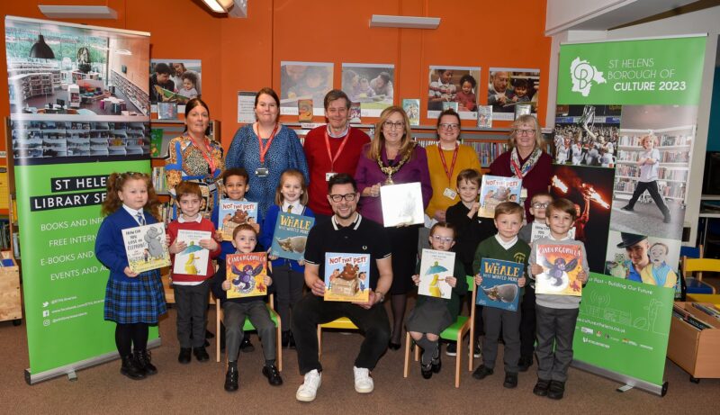 Mayor of St Helens Borough Cllr Sue Murphy with library staff, children and guests at this week